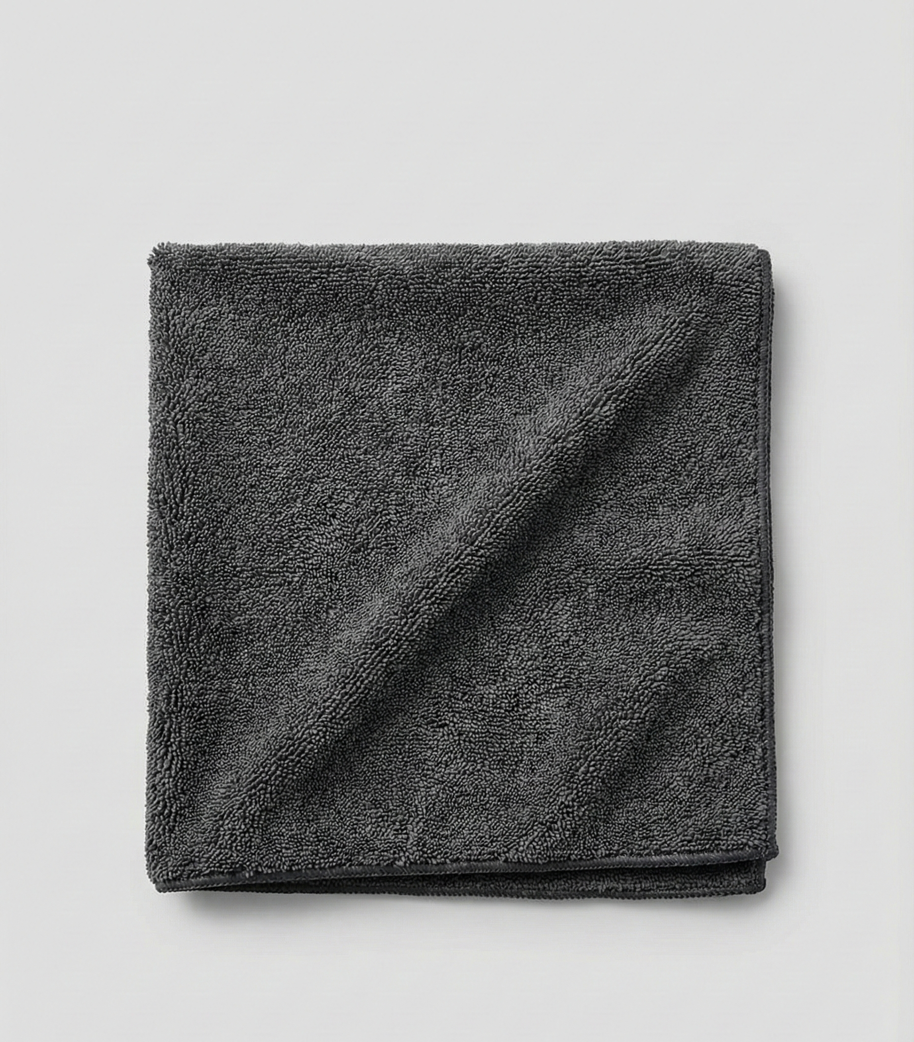 AutoPrro Folded dark gray towel on a light gray background