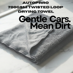 Folded gray towel with text about AUTOPRRO 700GSM twisted loop drying towel on a white background
