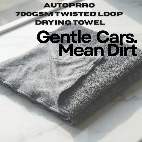 Folded gray towel with text about AUTOPRRO 700GSM twisted loop drying towel on a white background